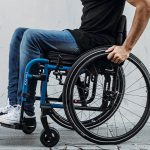 Why are wheelchair footrests essential for posture?