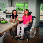 Can a reclining wheelchair assist with postural management?